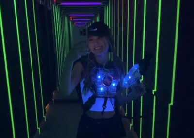 girl taking a selfie about to play laser tag